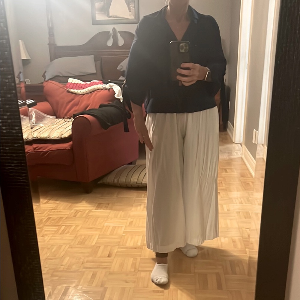 White Pleated Casual wide leg pants and baby blue lines shirt. Complete outfit